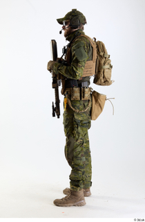 Andrew Elliott TS Pose with Machine Gun holding gun standing…
